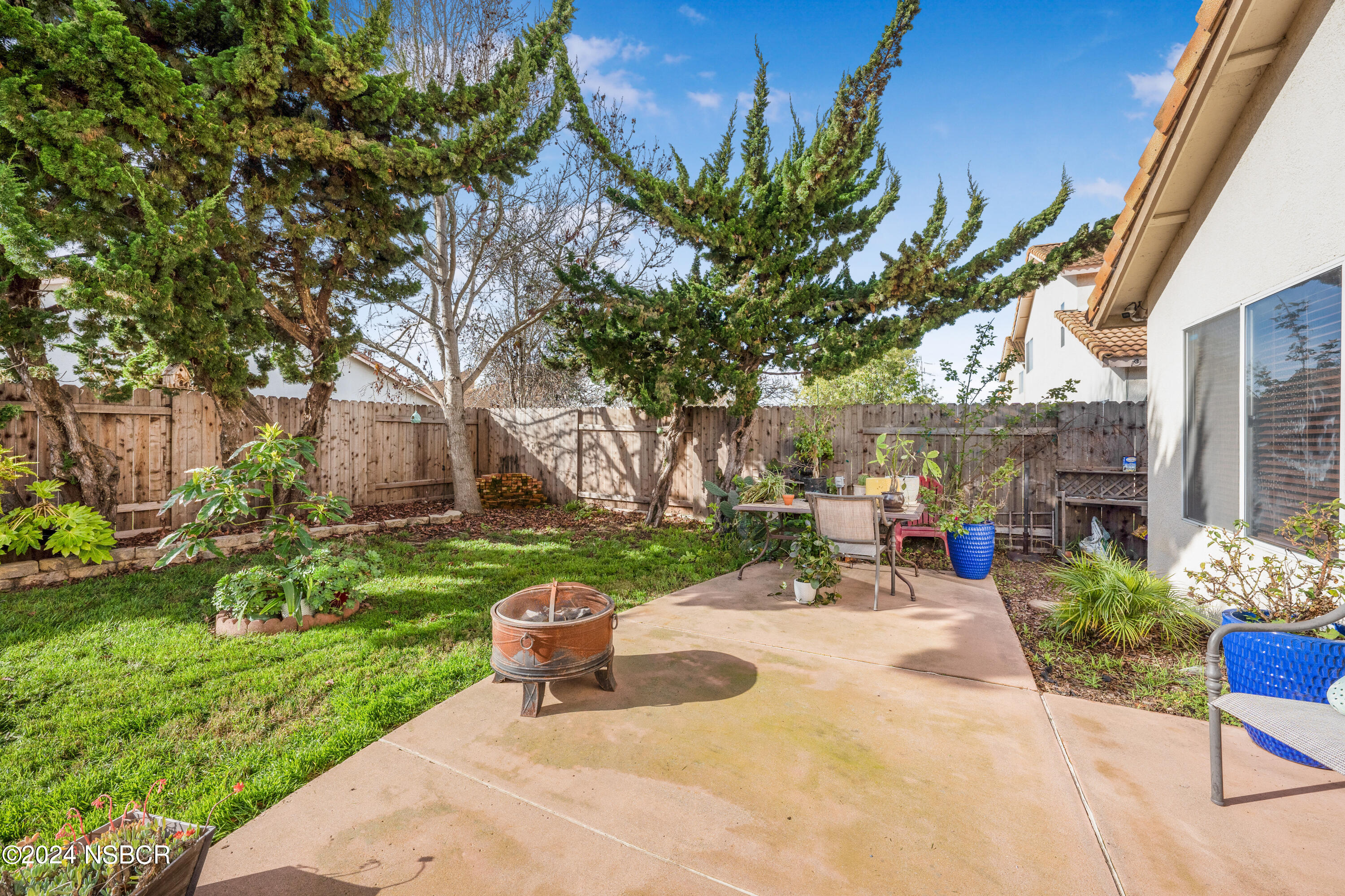 816 Cooper Drive Lompoc, CA 93436 - Photo 25 of 35 a view of a chair and table in backyard of the house