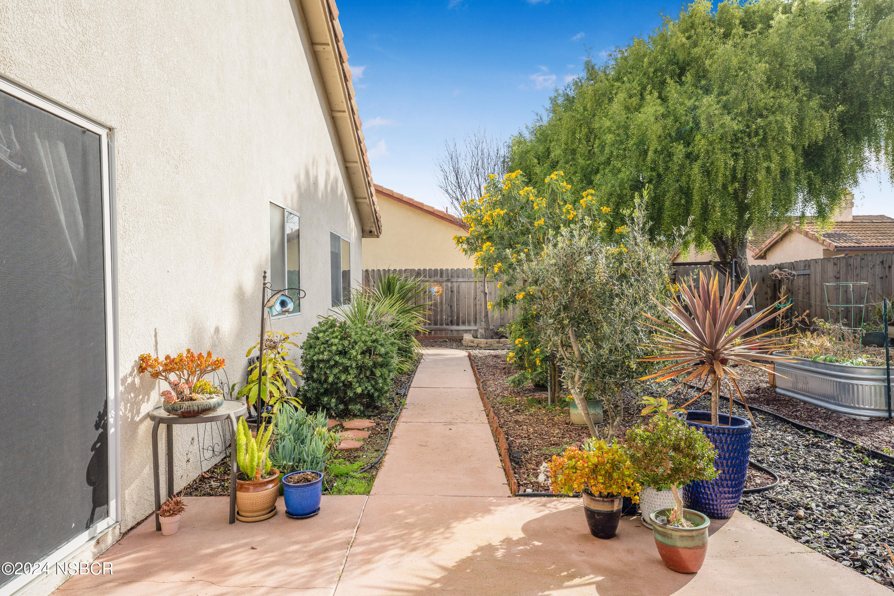 816 Cooper Drive Lompoc, CA 93436 - Photo 29 of 35 a view of a pathway with potted plants
