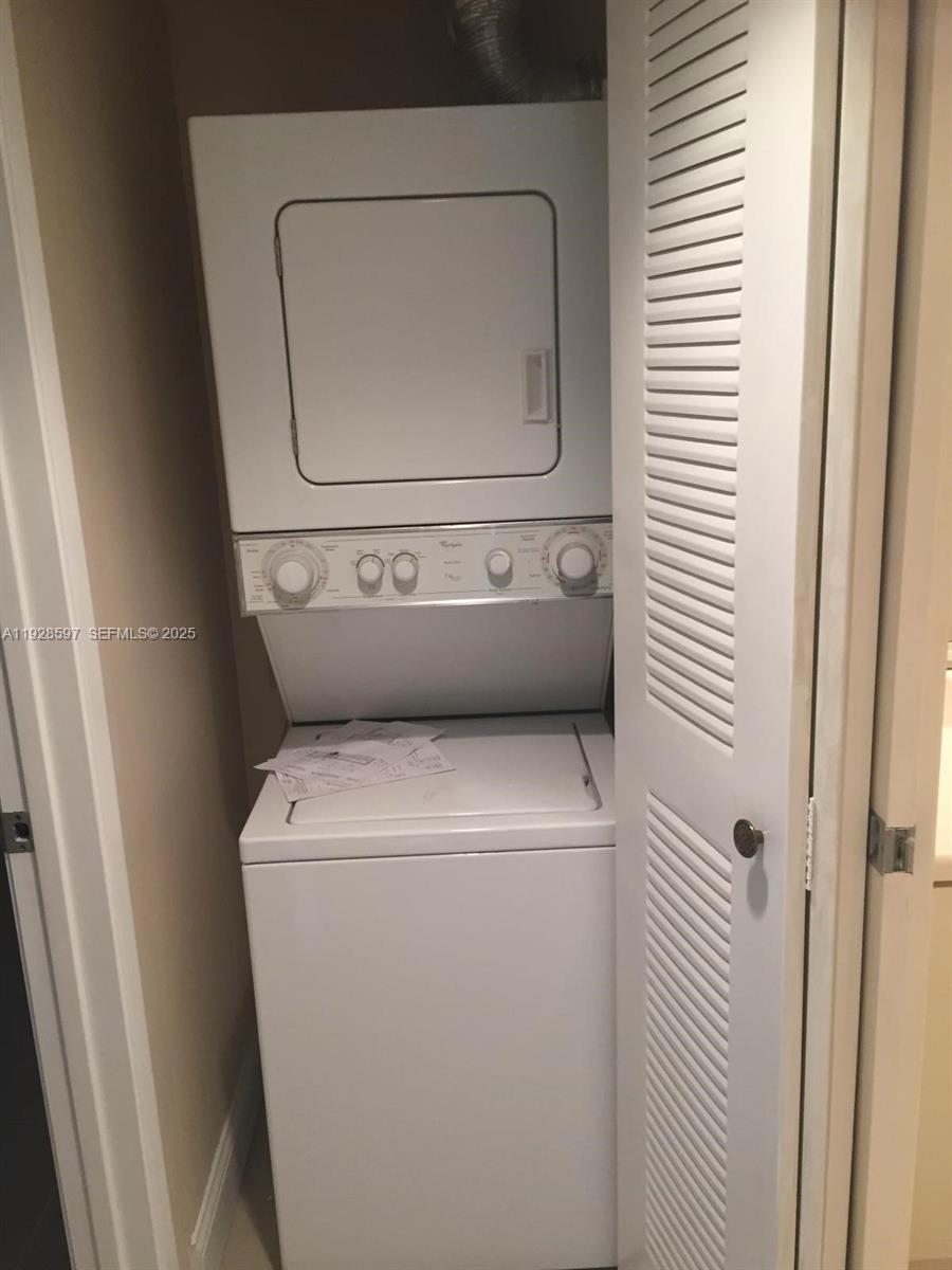 1201 Southwest 141st Avenue, Unit 304J Pembroke Pines, FL 33027 - Photo 12 of 31 a utility room with dryer and washer