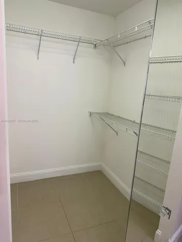 a view of a room with racks on the wall