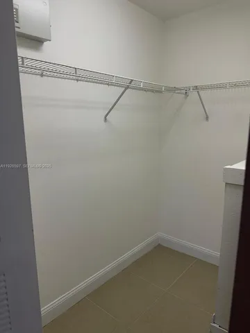 a view of an empty walk in closet
