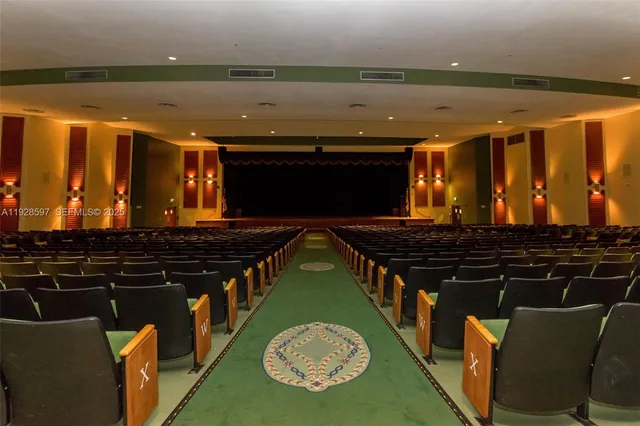 a blue swimming pool is sitting in the middle of a lake