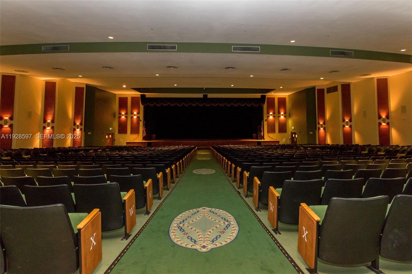 1201 Southwest 141st Avenue, Unit 304J Pembroke Pines, FL 33027 - Photo 19 of 31 a blue swimming pool is sitting in the middle of a lake