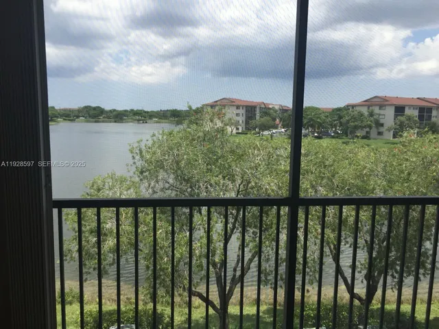 a view of a balcony with lake from a balcony