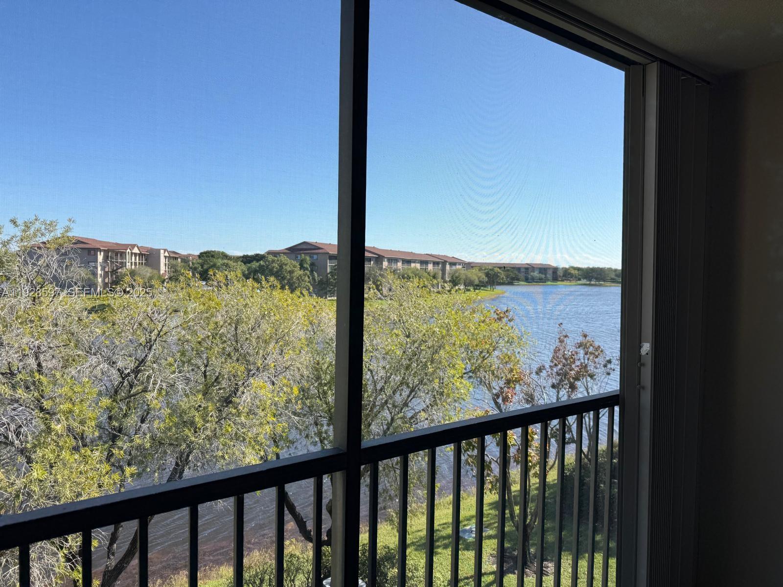 1201 Southwest 141st Avenue, Unit 304J Pembroke Pines, FL 33027 - Photo 5 of 31 a view of a balcony with an ocean view