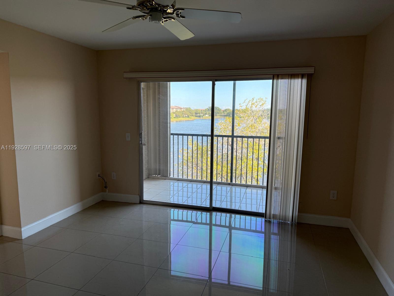 1201 Southwest 141st Avenue, Unit 304J Pembroke Pines, FL 33027 - Photo 6 of 31 a view of an empty room with a window