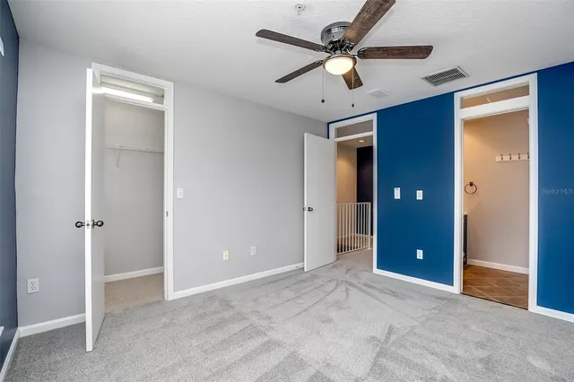 a view of an empty room with a bathroom