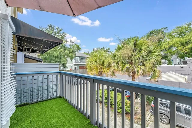 a view of balcony with wooden floor