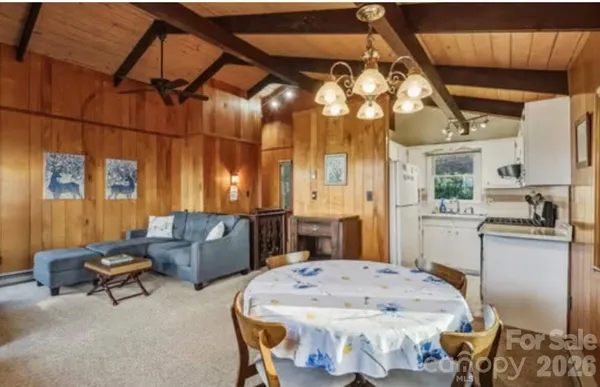 a kitchen with stainless steel appliances granite countertop a sink and a stove