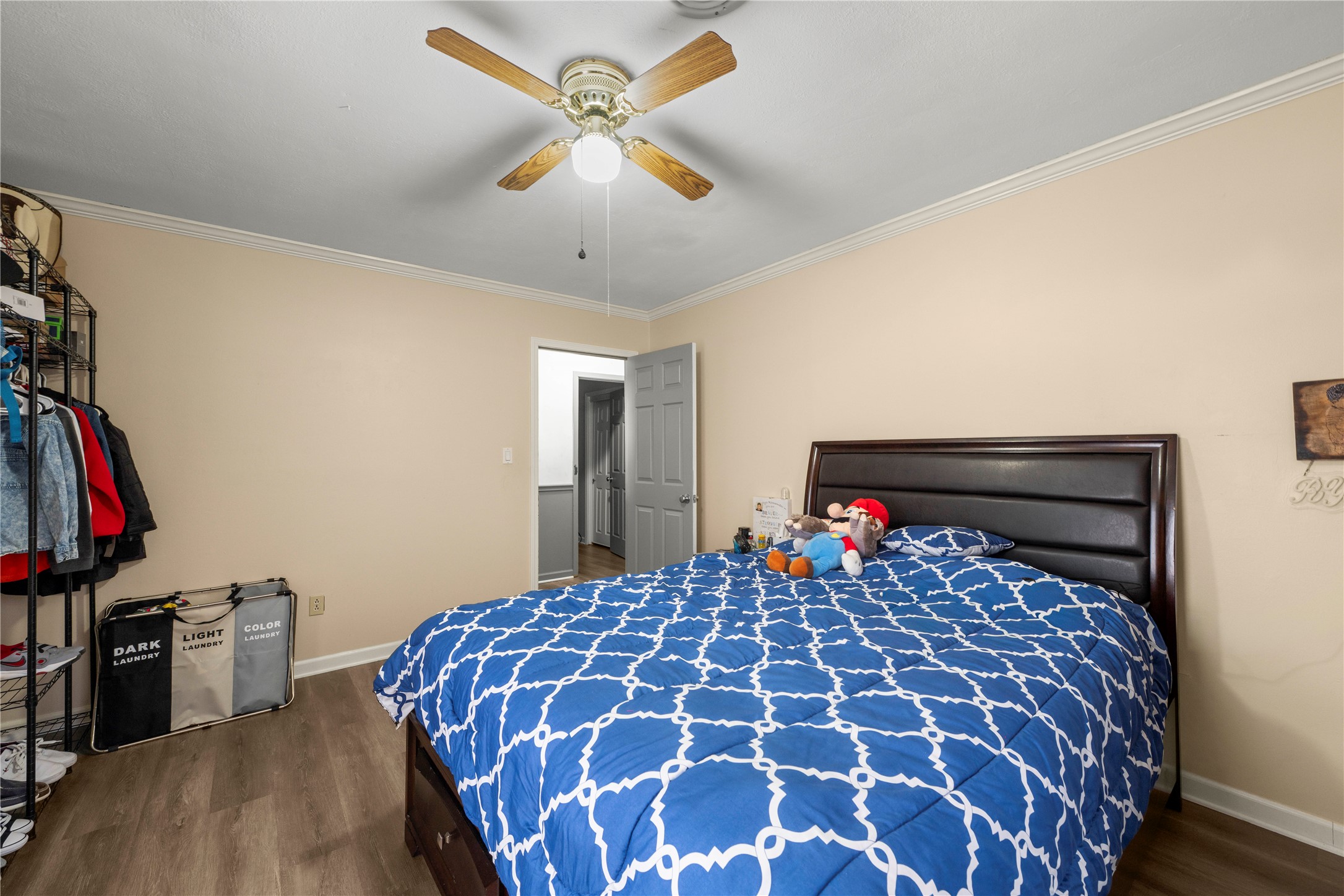 2915 County Road 153 Georgetown, TX 78626 - Photo 15 of 24 a bedroom with a large bed and a chandelier