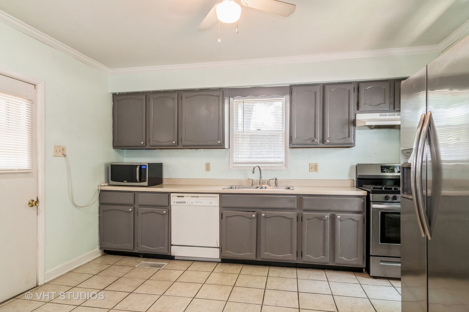 Undisclosed Address Hinckley, IL 60520 - Photo 3 of 10 a kitchen with a stove sink and cabinets