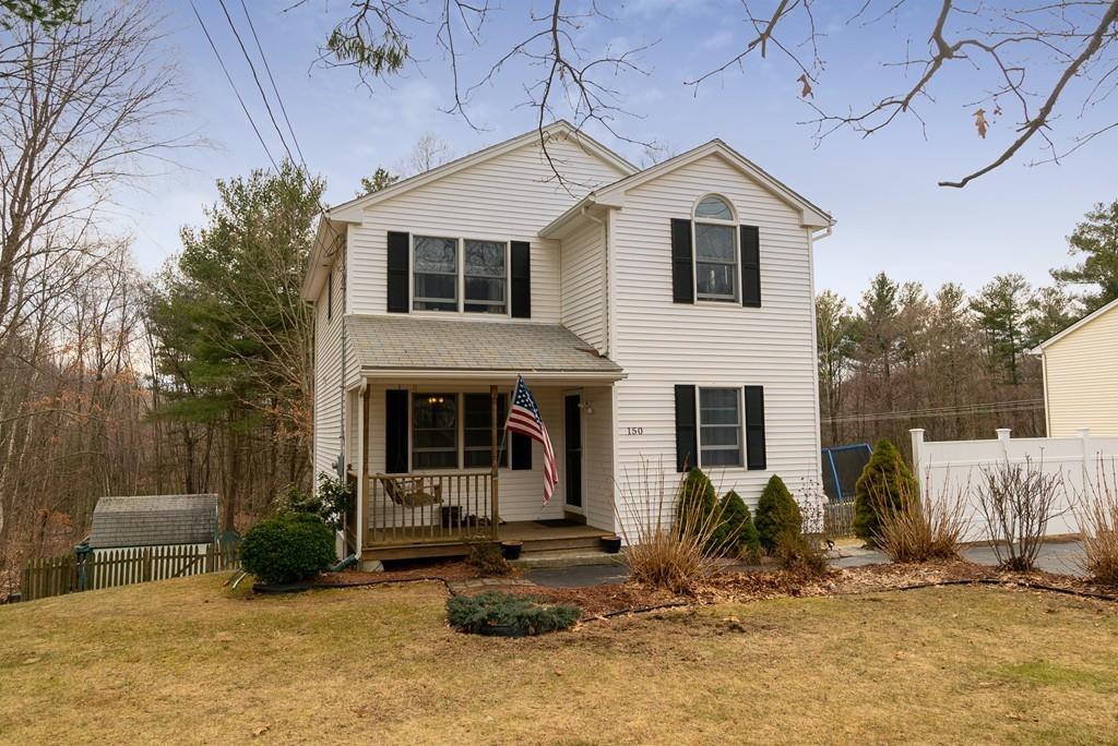 150 Lower Gore Road Webster, MA 01570 - Photo 2 of 20 a front view of a house with garden