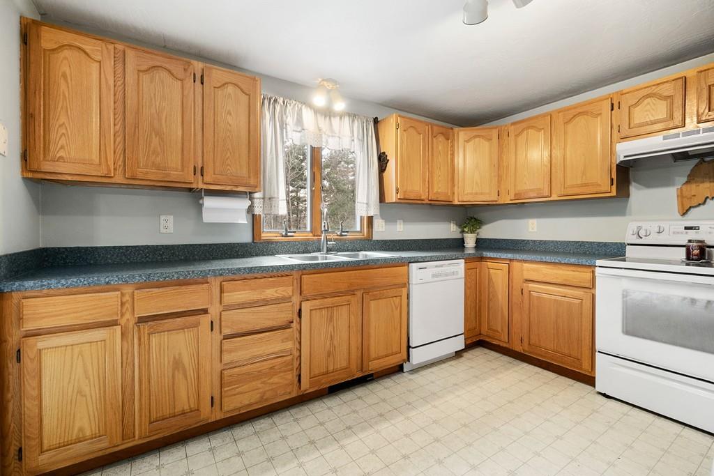 150 Lower Gore Road Webster, MA 01570 - Photo 5 of 20 a kitchen with granite countertop cabinets stainless steel appliances a sink and window