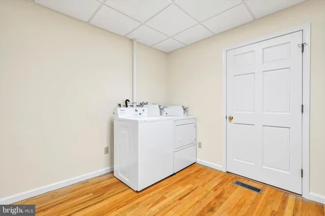 a utility room with a sink washer and dryer