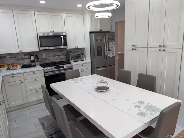 a bathroom with a sink a toilet and bathtub