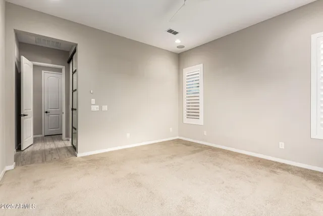 an empty room with windows