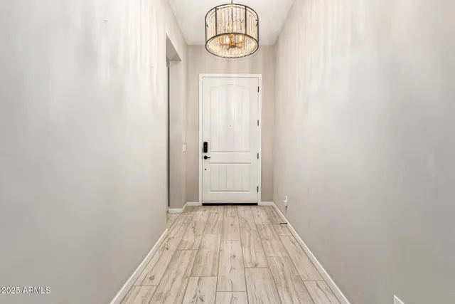 a view of a room with wooden floor
