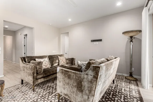 a living room with furniture and a rug