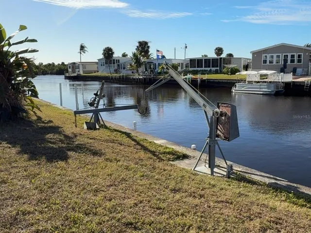 a living room with lots of furniture and a wooden floor