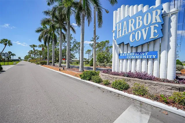 a view of a brick house with a large windows next to a road