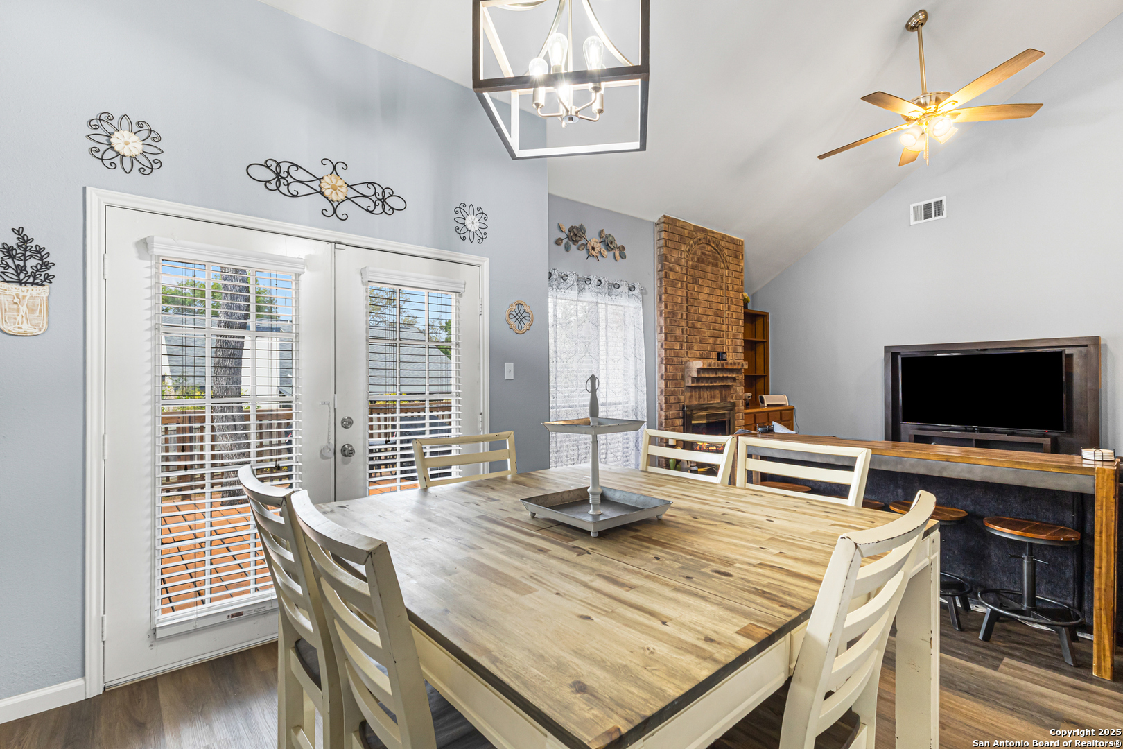 5617 Timber Rain San Antonio, TX 78250 - Photo 14 of 32 a view of a dining room with furniture window and wooden floor