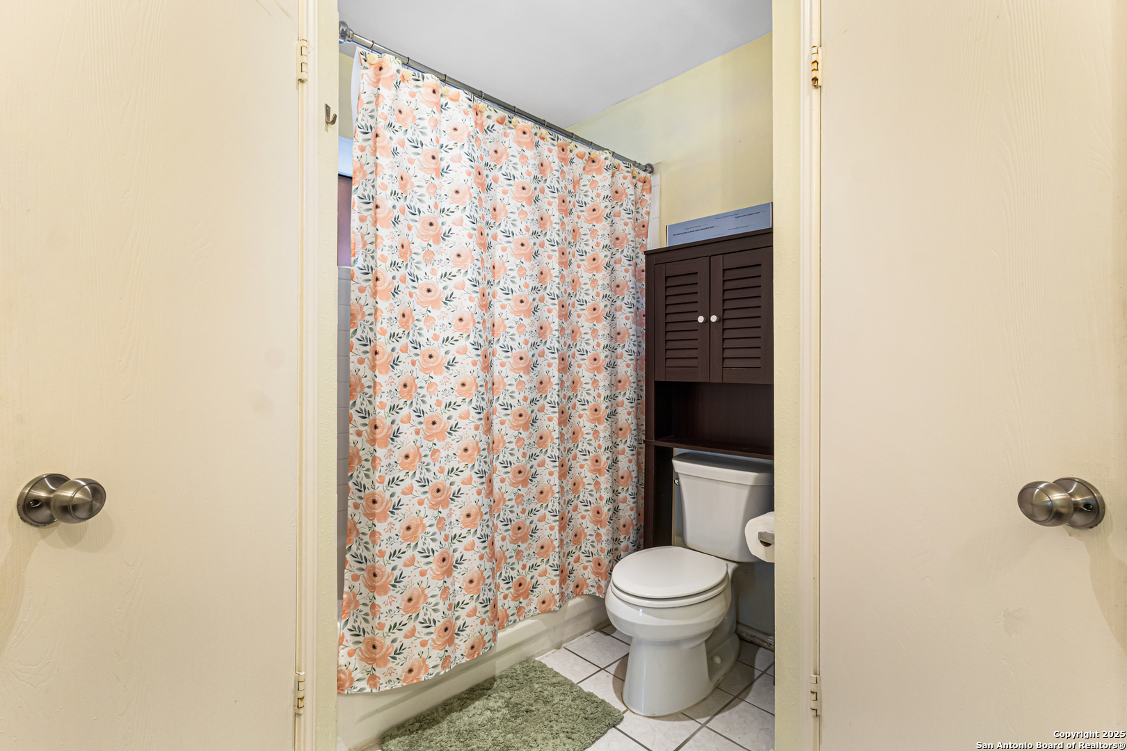 5617 Timber Rain San Antonio, TX 78250 - Photo 20 of 32 a bathroom with a toilet and a shower