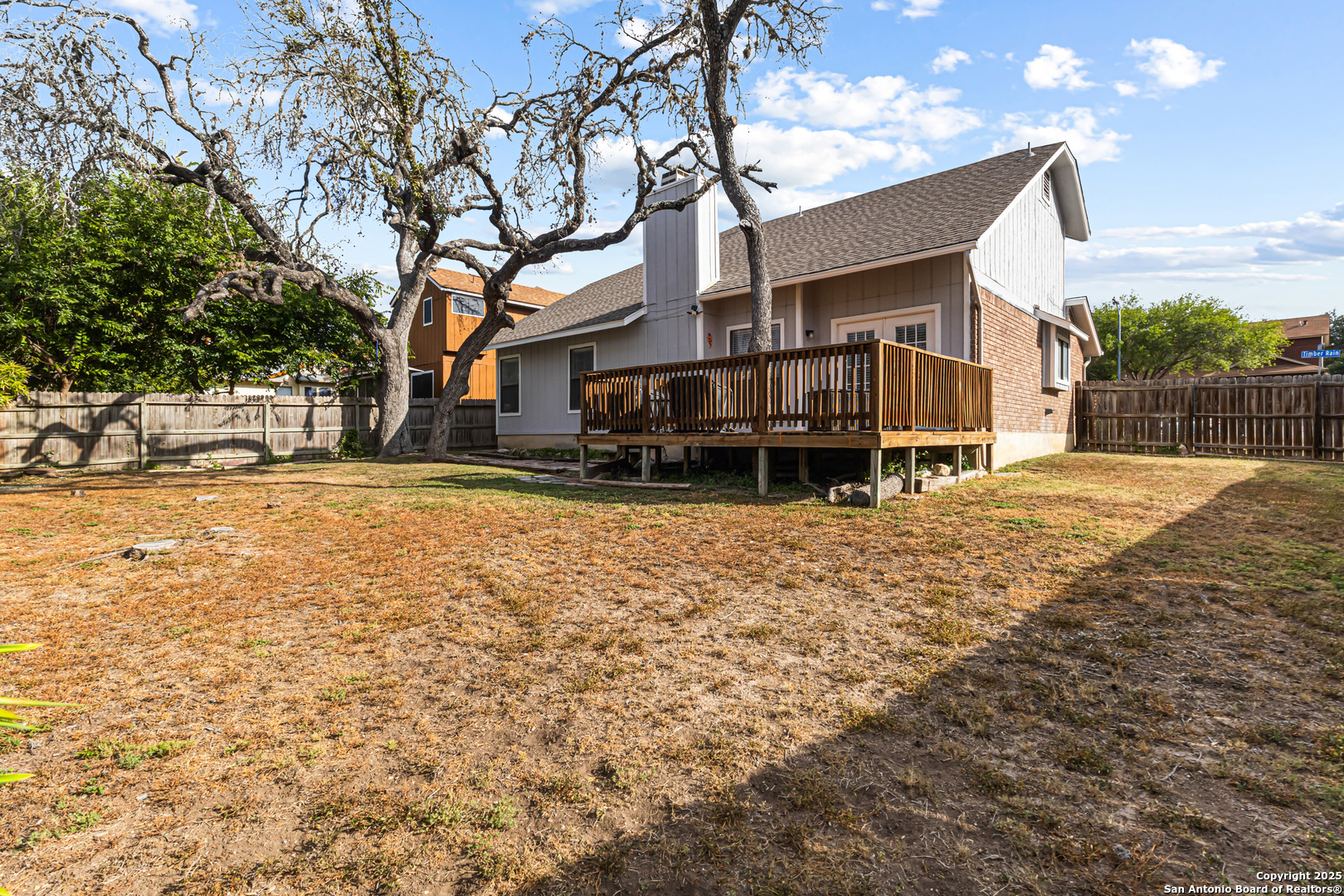 5617 Timber Rain San Antonio, TX 78250 - Photo 32 of 32 a view of a house with a yard