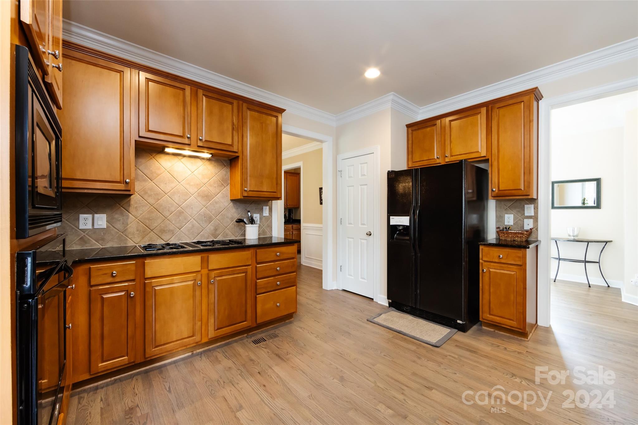 1820 Chestnut Hill Drive Tega Cay, SC 29708 - Photo 15 of 47 a kitchen with stainless steel appliances granite countertop a refrigerator a stove and a sink
