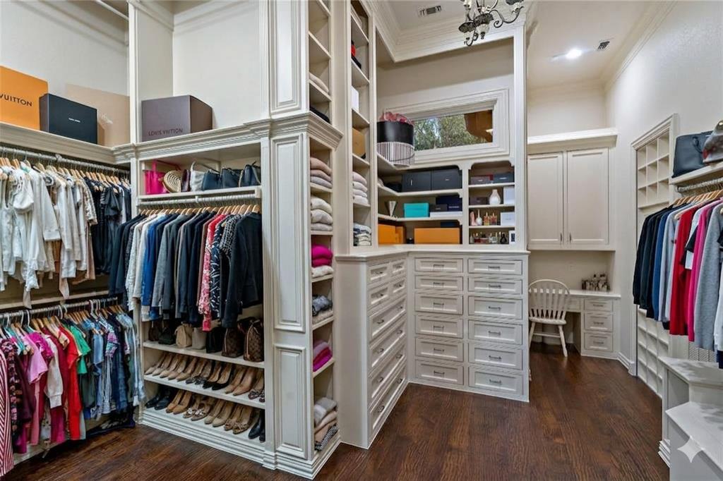6413 Old Gate Road Plano, TX 75024 - Photo 20 of 39 a view of walk in closet with clothes and shoes