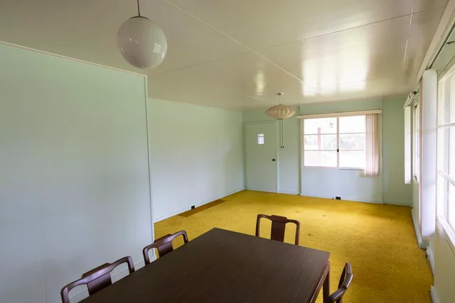 a bedroom with bed and window