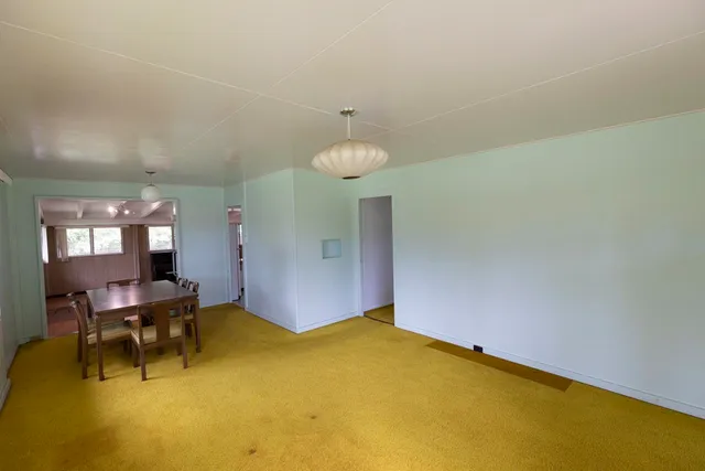 a view of a livingroom with furniture and chandelier