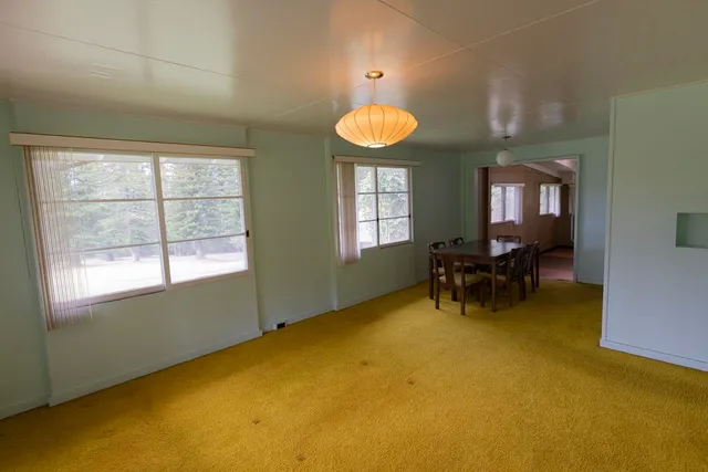 a view of a livingroom with furniture and a window