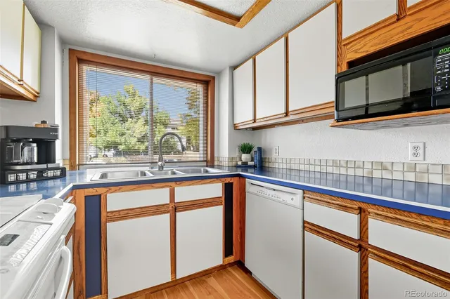 a open kitchen with stainless steel appliances granite countertop a sink and cabinets