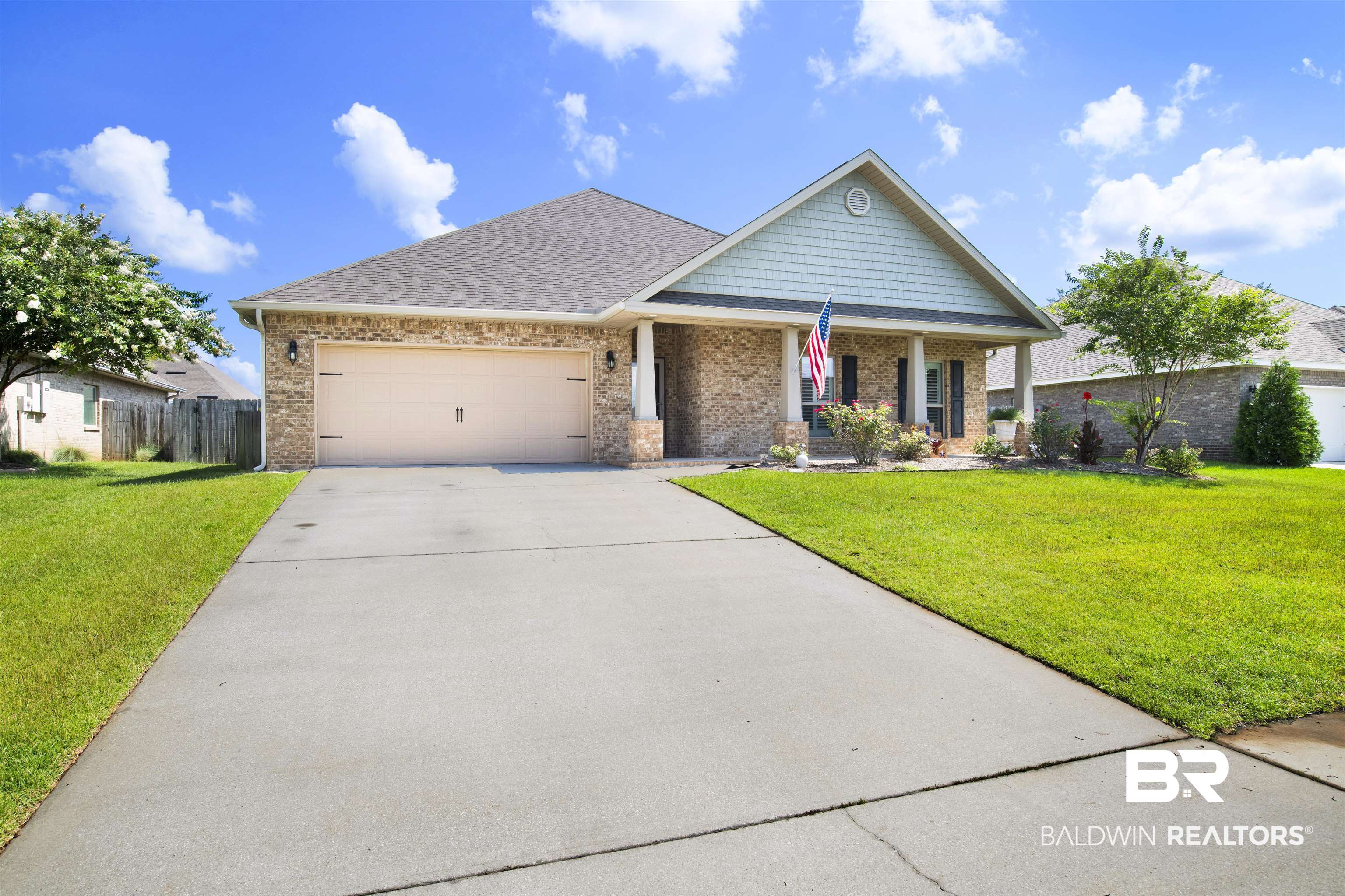 278 Silo Loop Fairhope, AL 36532 - Photo 25 of 26 Craftsman-style house featuring brick siding, concrete driveway, an attached garage, a porch, and a shingled roof