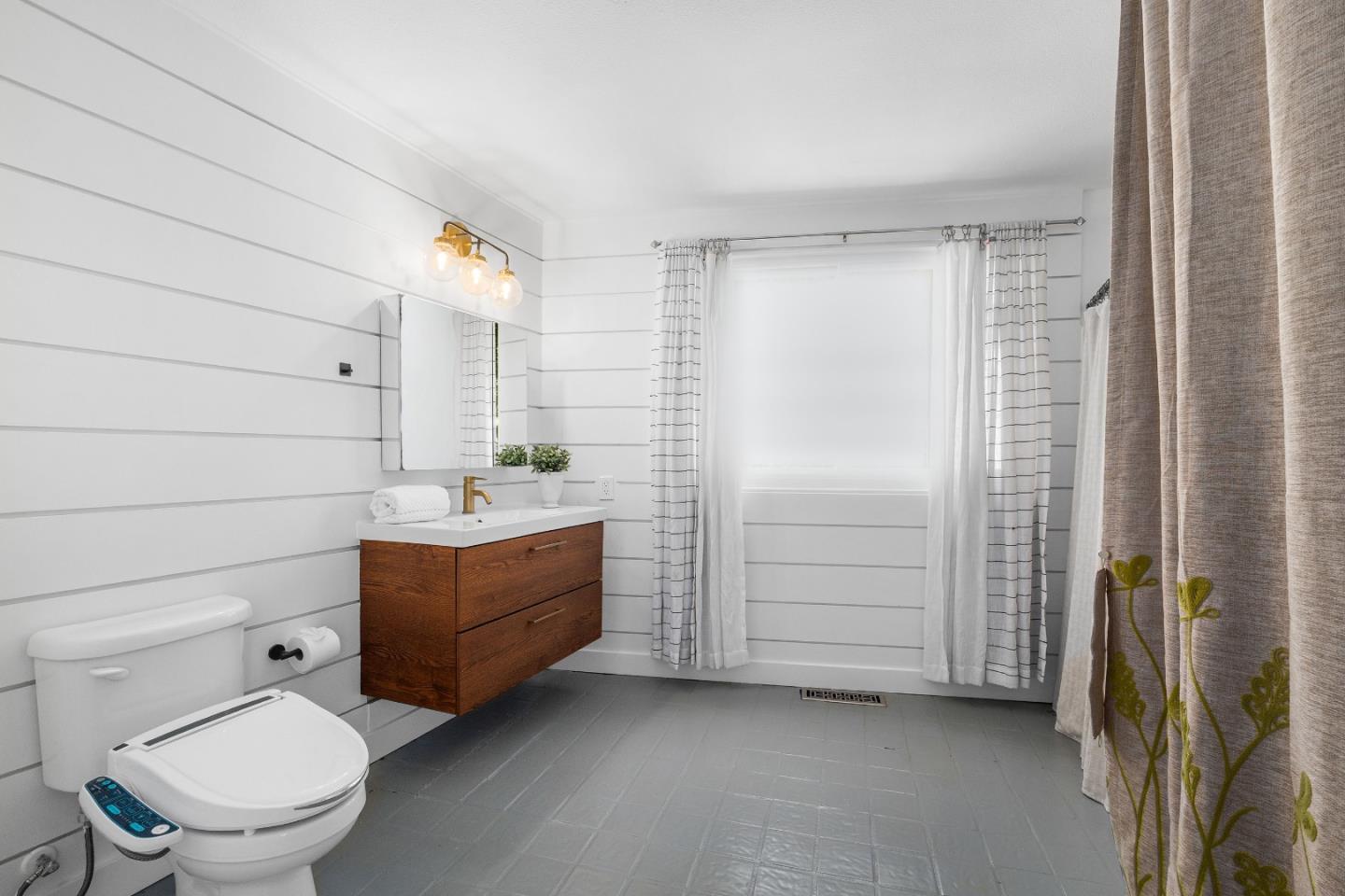 321 Valencia Road Aptos, CA 95003 - Photo 31 of 50 a bathroom with a sink a toilet and shower