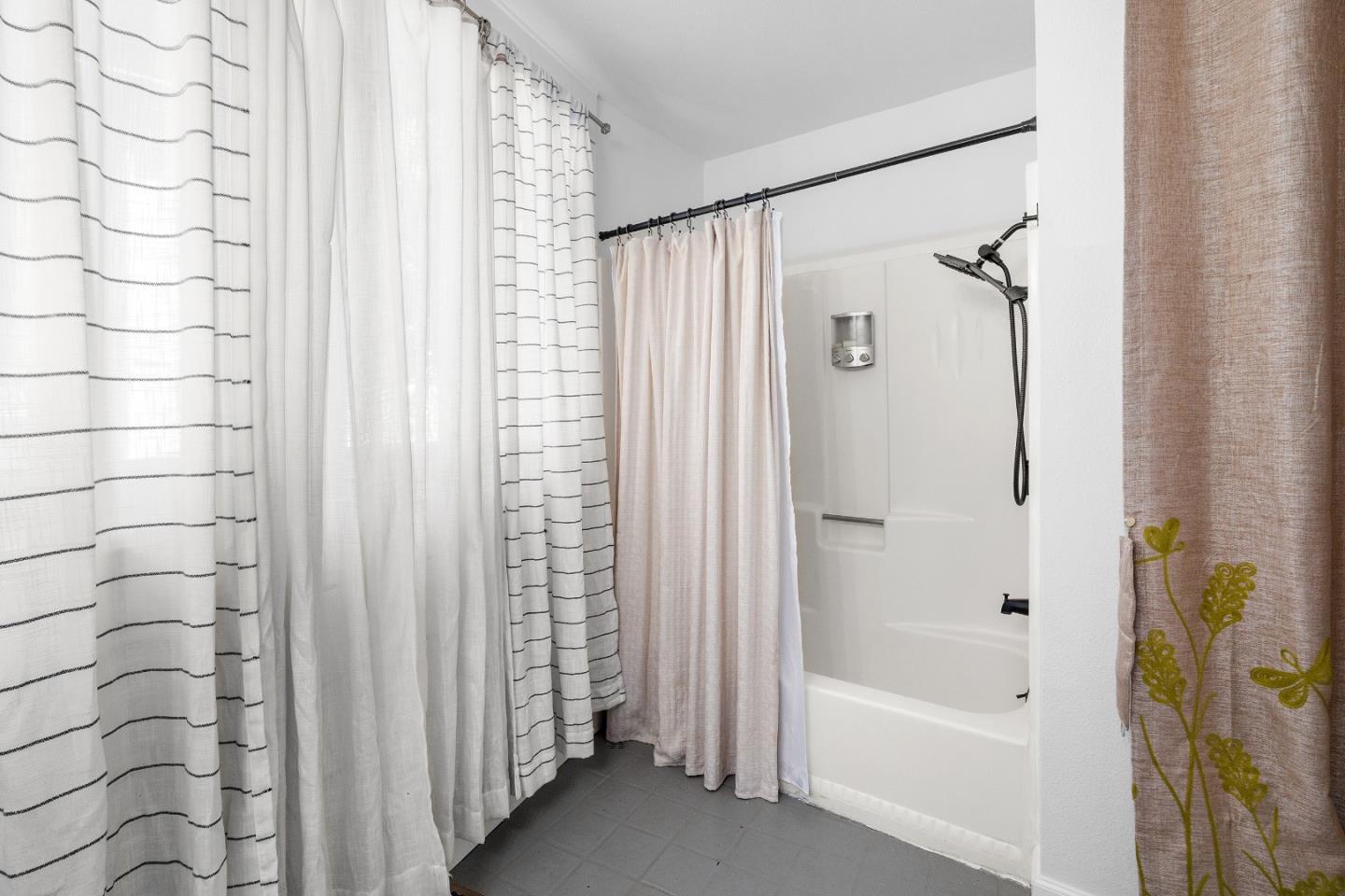 321 Valencia Road Aptos, CA 95003 - Photo 33 of 50 a bathroom with a bathtub and shower