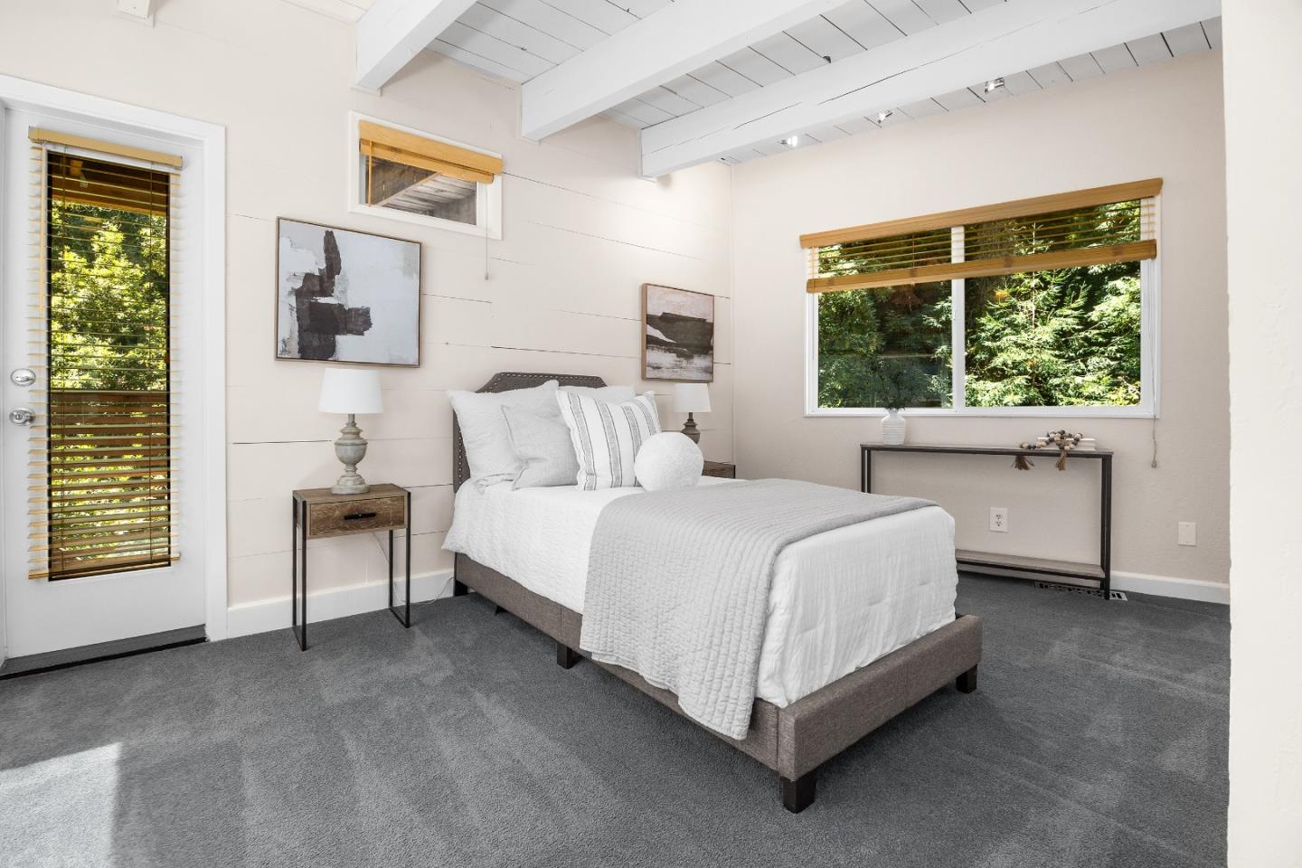 321 Valencia Road Aptos, CA 95003 - Photo 35 of 50 a spacious bedroom with a bed and a window