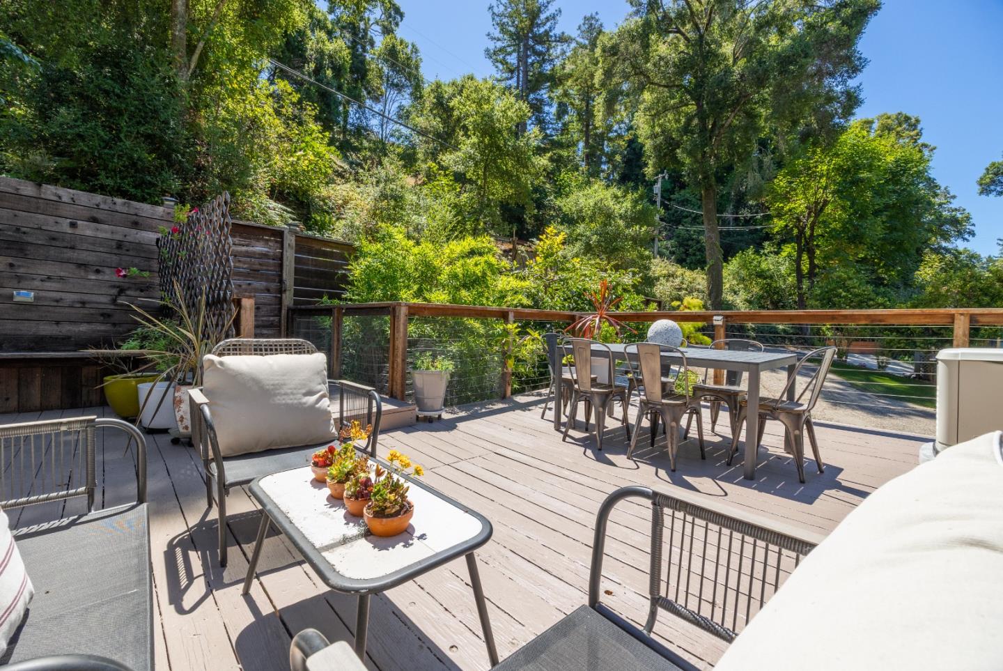 321 Valencia Road Aptos, CA 95003 - Photo 41 of 50 a view of a patio with a dining table and chairs with wooden floor