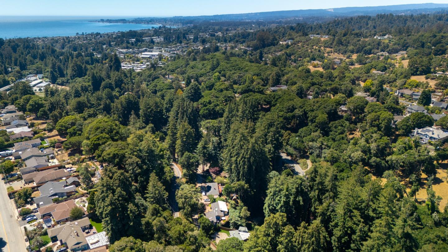 321 Valencia Road Aptos, CA 95003 - Photo 47 of 50 an aerial view of a houses with a lush green hillside