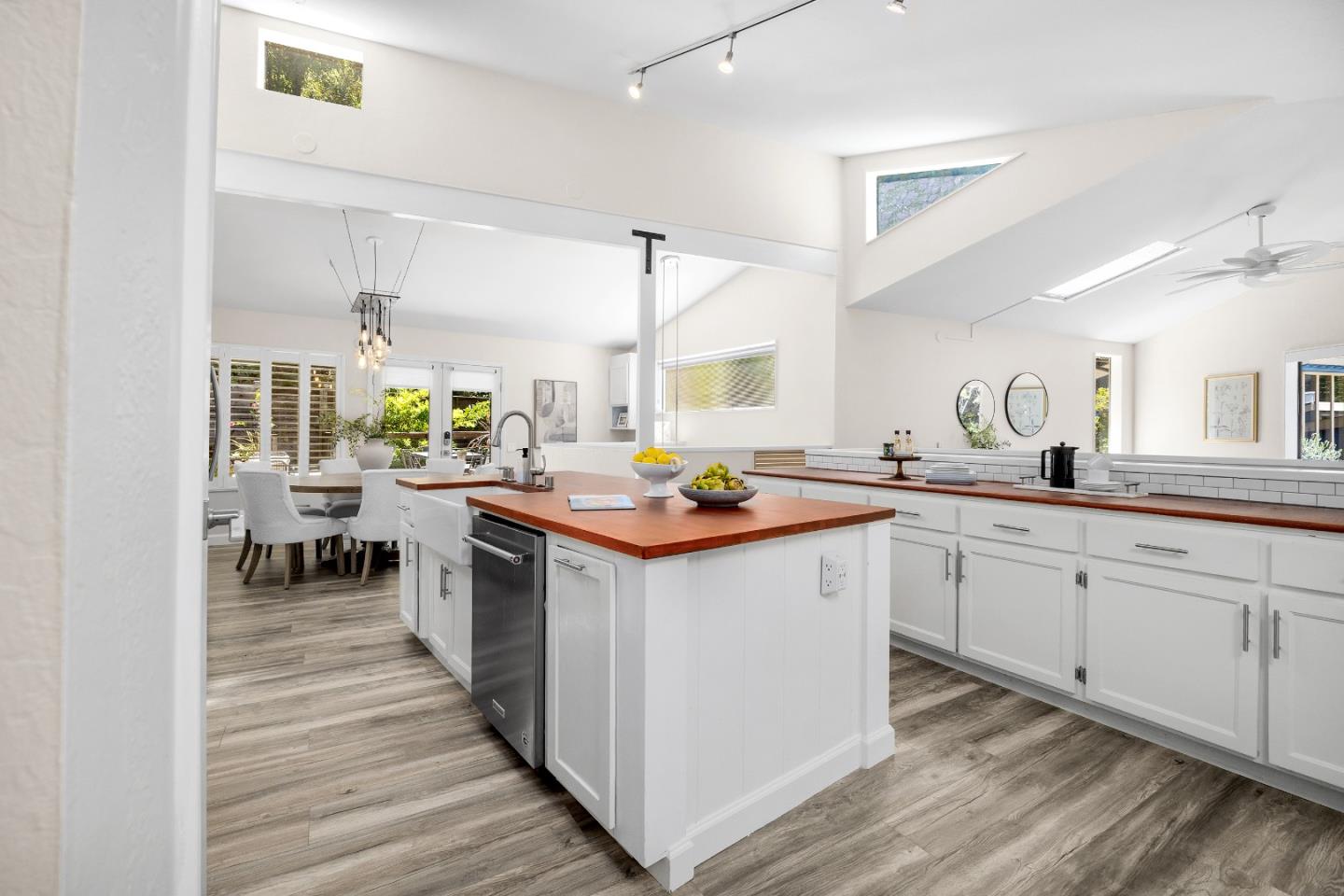 321 Valencia Road Aptos, CA 95003 - Photo 5 of 50 a kitchen with a sink stove and cabinets
