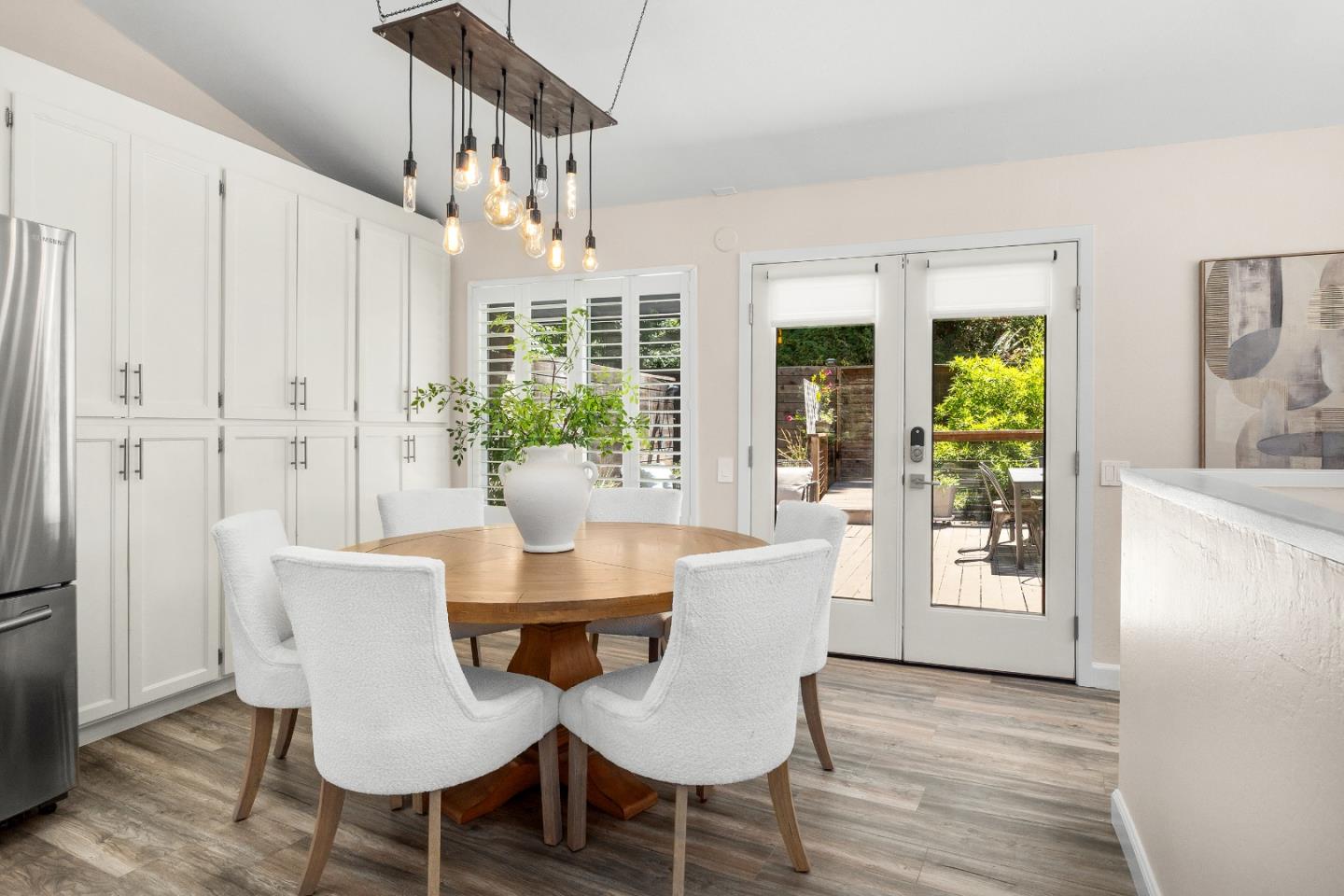 321 Valencia Road Aptos, CA 95003 - Photo 9 of 50 a view of a dining room with furniture window and wooden floor