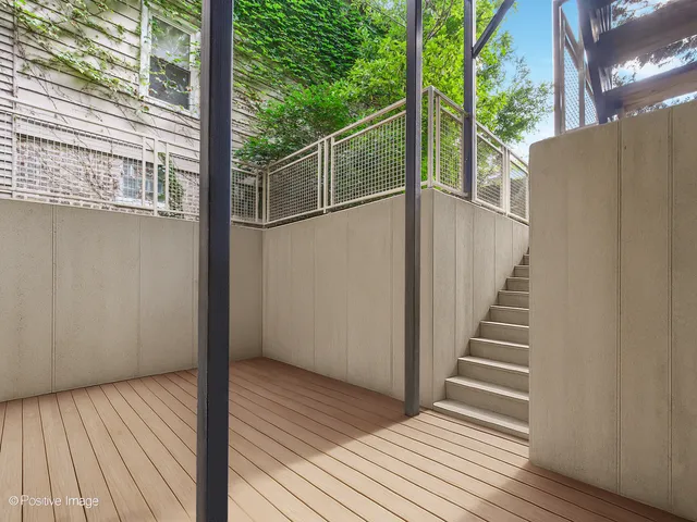 a view of balcony with wooden floor
