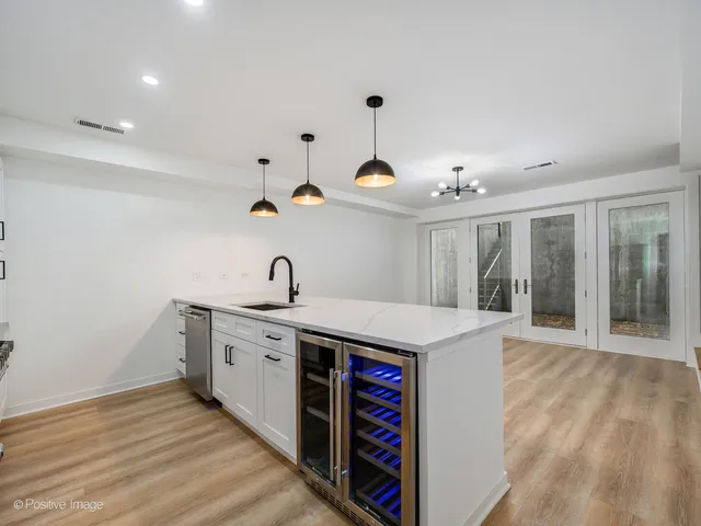 a kitchen with a sink and cabinets