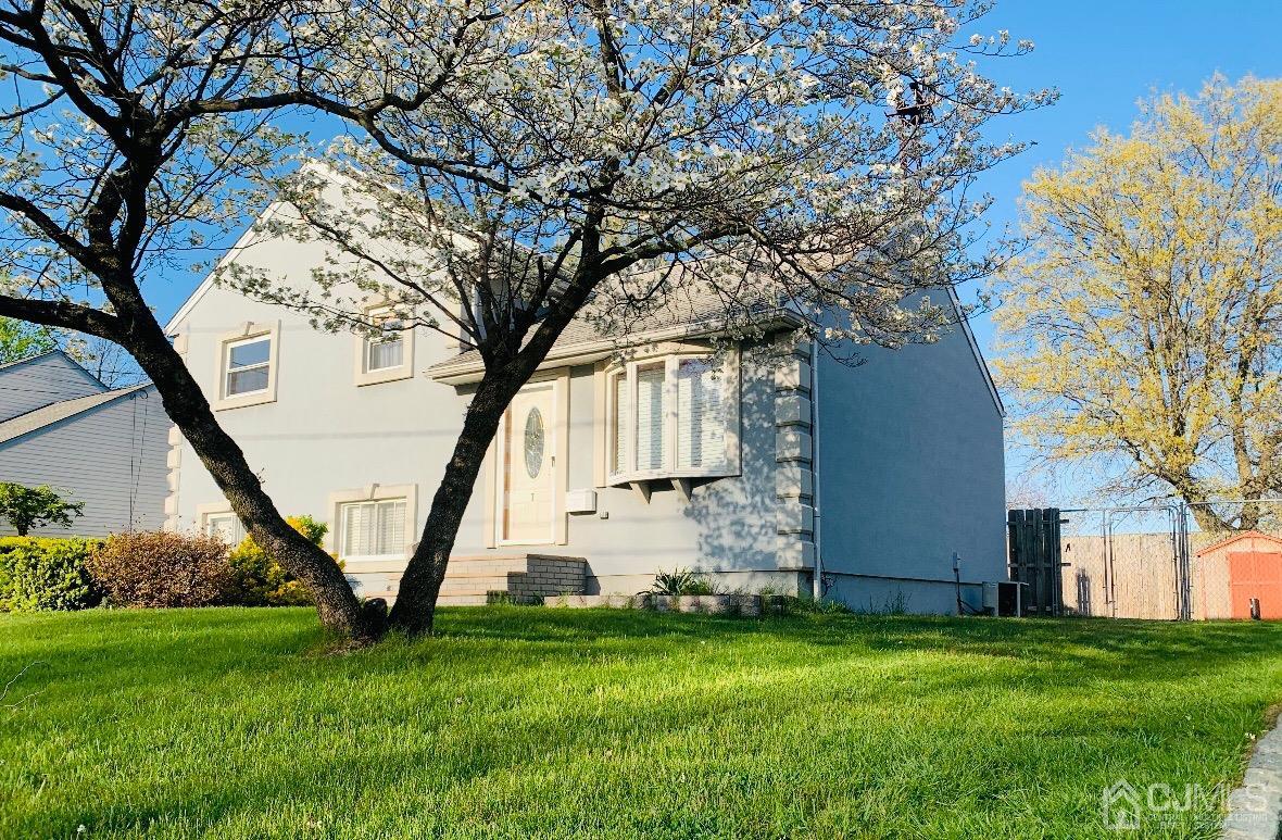 7 Wilshire Road Edison, NJ 08817 - Photo 1 of 14 a view of backyard with a garden and entertaining space