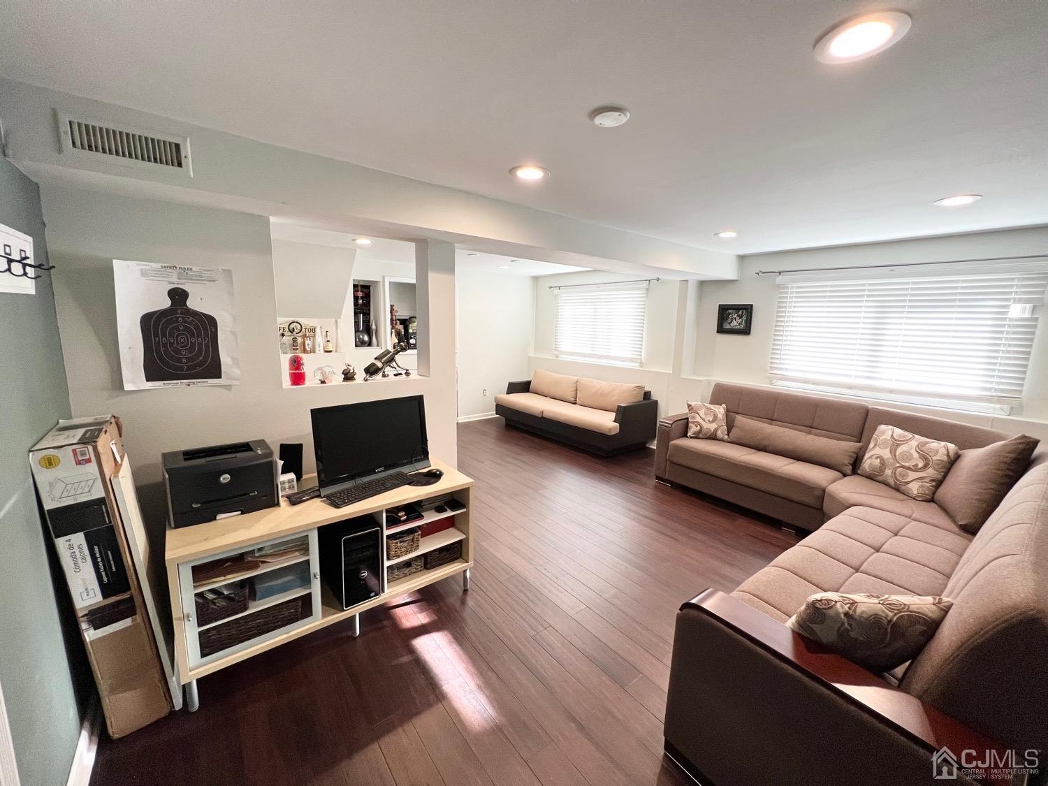 7 Wilshire Road Edison, NJ 08817 - Photo 12 of 14 a living room with furniture and a flat screen tv