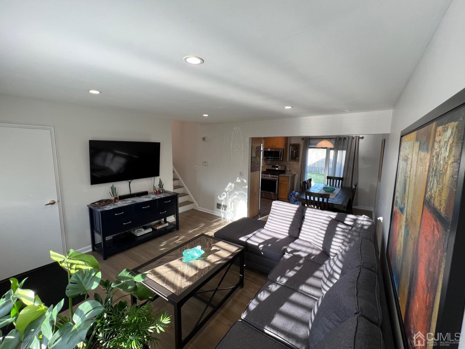 7 Wilshire Road Edison, NJ 08817 - Photo 2 of 14 a living room with furniture and a flat screen tv