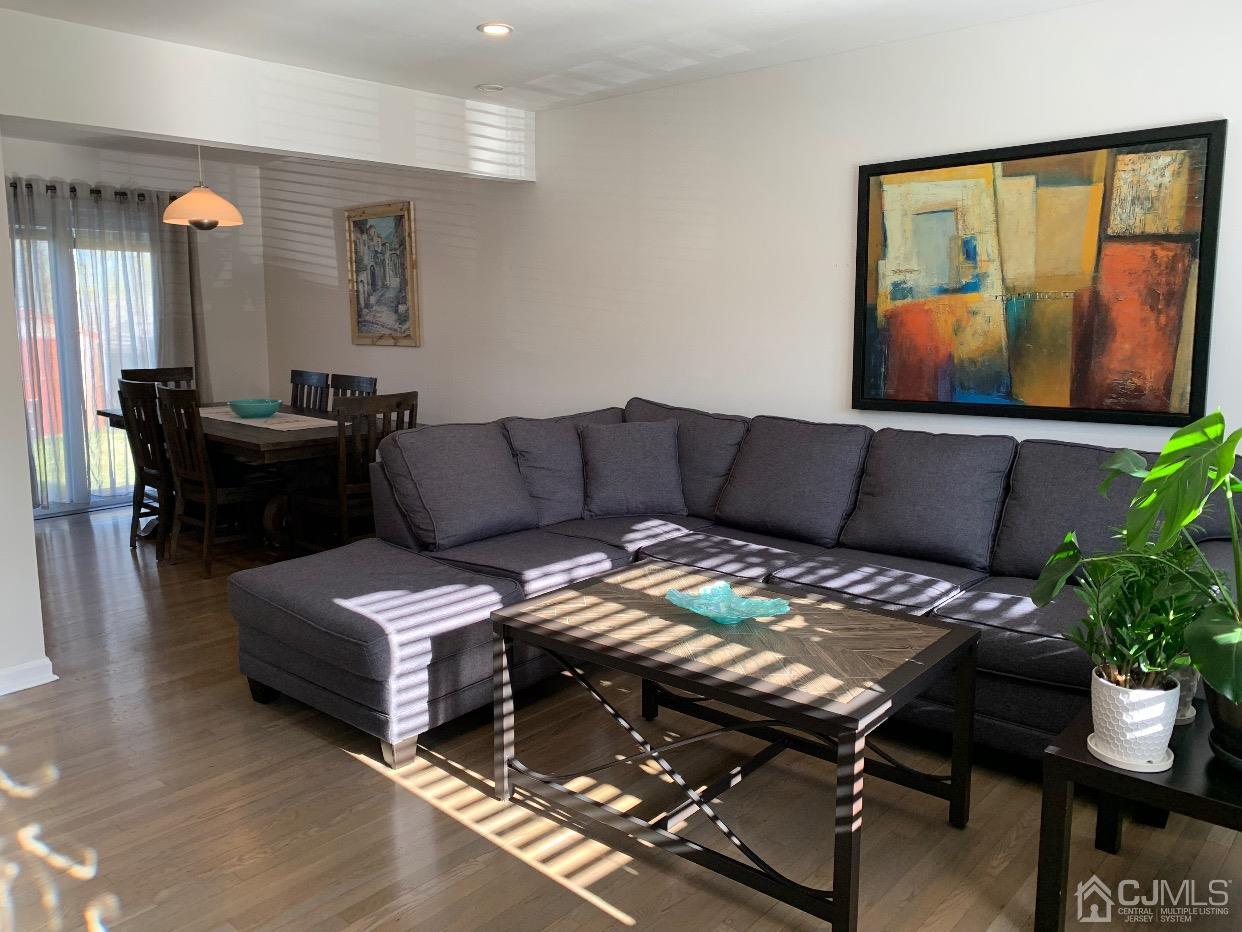 7 Wilshire Road Edison, NJ 08817 - Photo 3 of 14 a living room with furniture and wooden floor