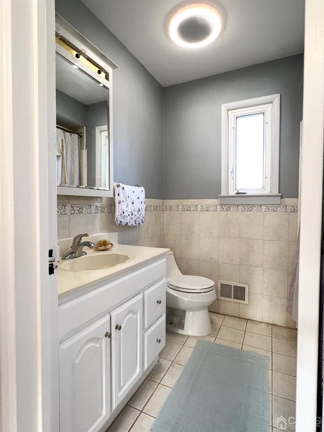 7 Wilshire Road Edison, NJ 08817 - Photo 8 of 14 a view of a bathroom with a sink and a toilet