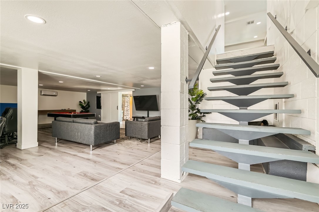 2520 Castlesands Way Las Vegas, NV 89121 - Photo 22 of 59 Stairs with wood finished floors and recessed lighting