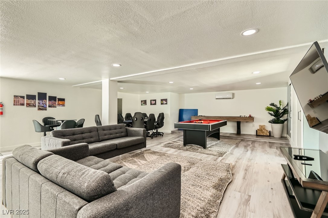 2520 Castlesands Way Las Vegas, NV 89121 - Photo 23 of 59 Living area with a textured ceiling, light wood finished floors, pool table, and recessed lighting